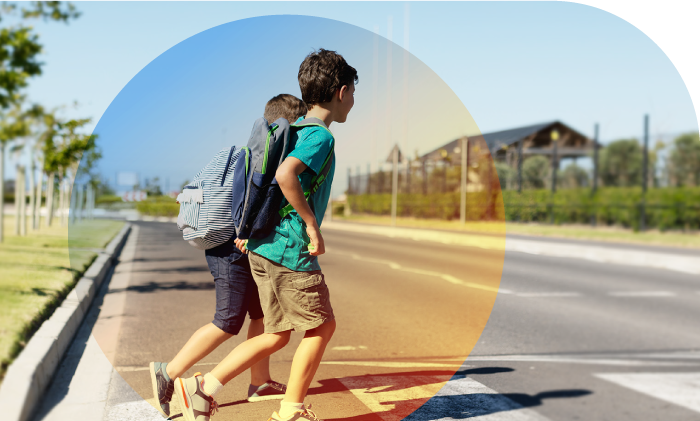 Two children crossing the street