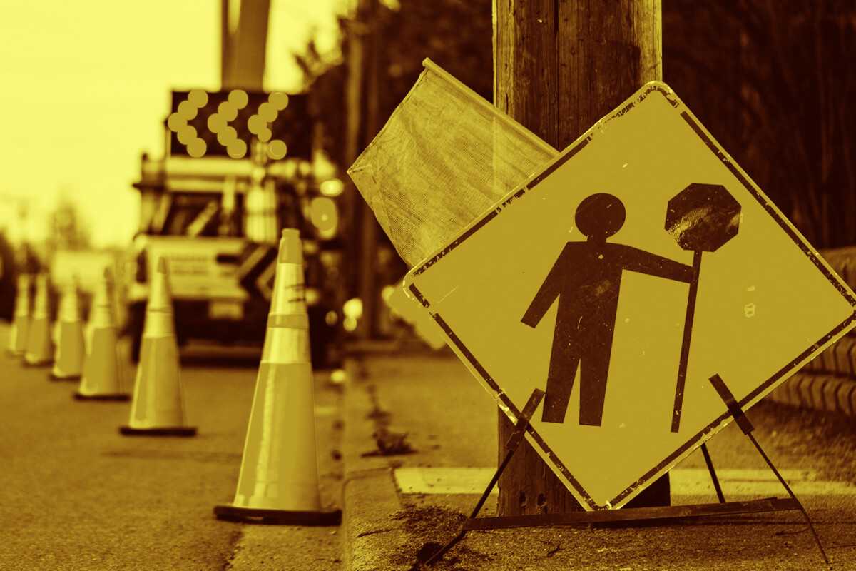 Roadwork sign with traffic cones on a street in Nevada.